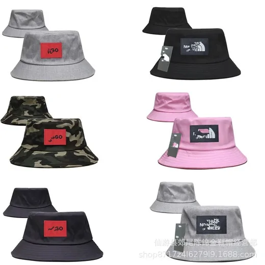 Grid of bucket hats in grey, black, pink and camouflage, each with a patch on the front