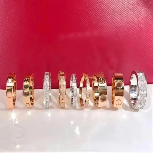 Line of slim bangles in rose gold, yellow gold and silver tones standing upright