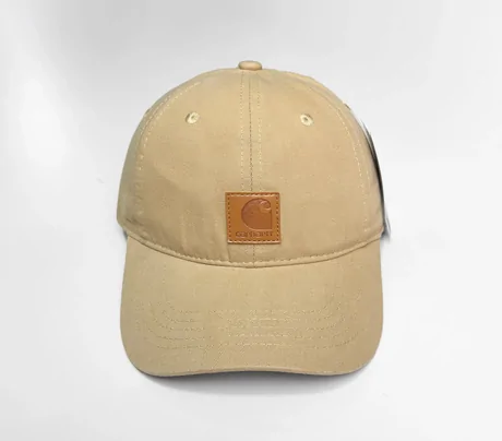 Beige canvas baseball cap with a small square patch on a white background