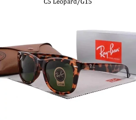 Tortoise-shell sunglasses with green lenses beside a case, labelled C5 Leopard/G15