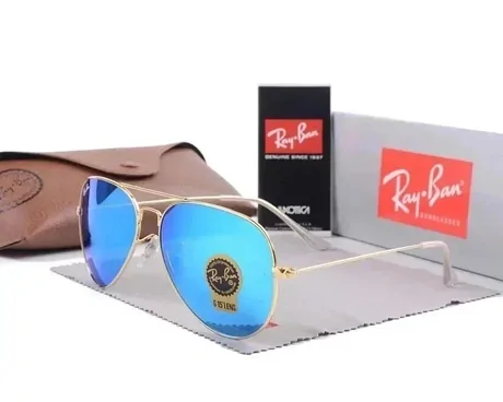 Blue mirror aviator sunglasses in front of a brown case and a red display box