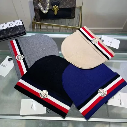 Knitted beanies in black, white, navy and red with striped cuffs