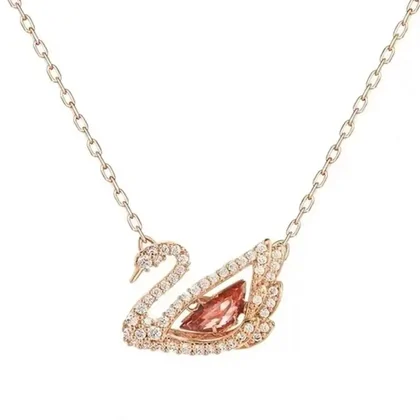 Rose-gold swan pendant with a pink stone on a fine chain